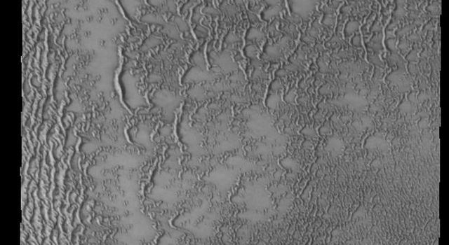 Siton Undae is a large dune field located in the northern plains near Escorial Crater. This image from NASA's 2001 Mars Odyssey spacecraft shows part of a dune field just west of Escorial Crater (just off the top of image).